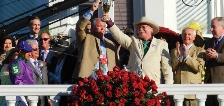 Steve Coburn (in Stetson) holds the prize at Churchill Downs. Photo by Penelope P. Miller/America's Best Racing.
