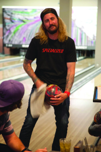 At Men’s Bowling League,. ball-polishing is a practiced art form. Here, Craig Balogh shows off his technique. Photo by Jacob Pelligrini.