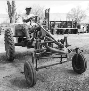 Steve Baldwin, co-owner of Bishop Creek Farm in Big Pine, pilots his refurbished, “zero emissions” electric tractor. Photo courtesy: Sheet staff.
