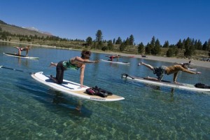 Paddleboarders do a yoga pose that no one in the Sheet office can name/identify. Photo courtesy: Bryan Thomson.