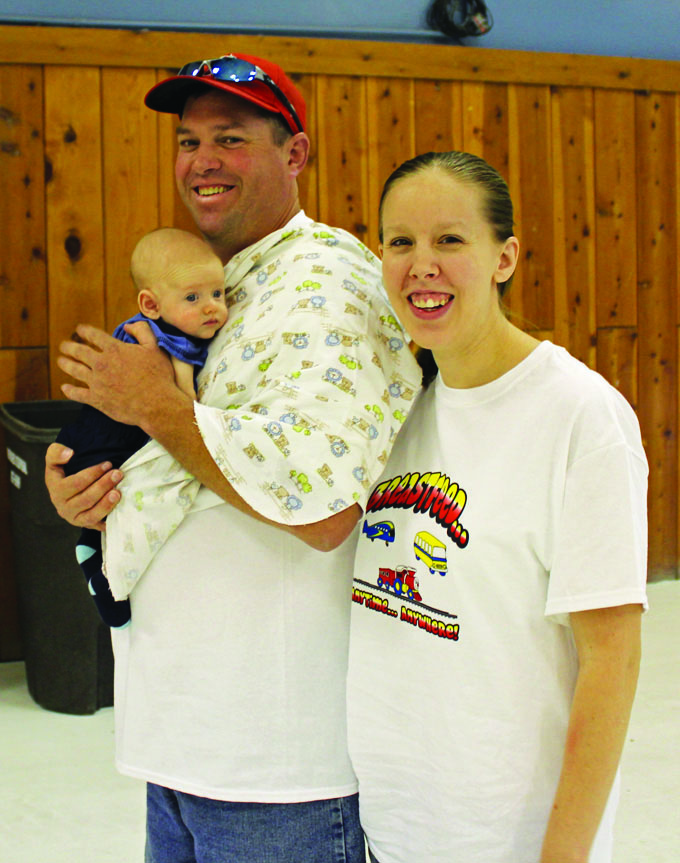 IMG_0909- Local Fedex Guy Travis with wife Jessica, proudly show 'Daddy's Big Guy', 2 month old Elija at the Walk edit web