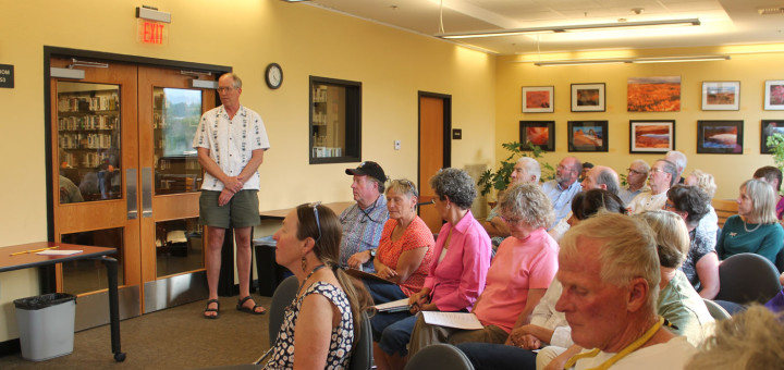 Mammoth Lakes Branch Manager Doug Oldham (standing) addresses the MCOE Board in front of a packed house on Aug. 27. Photo courtesy: Vane.